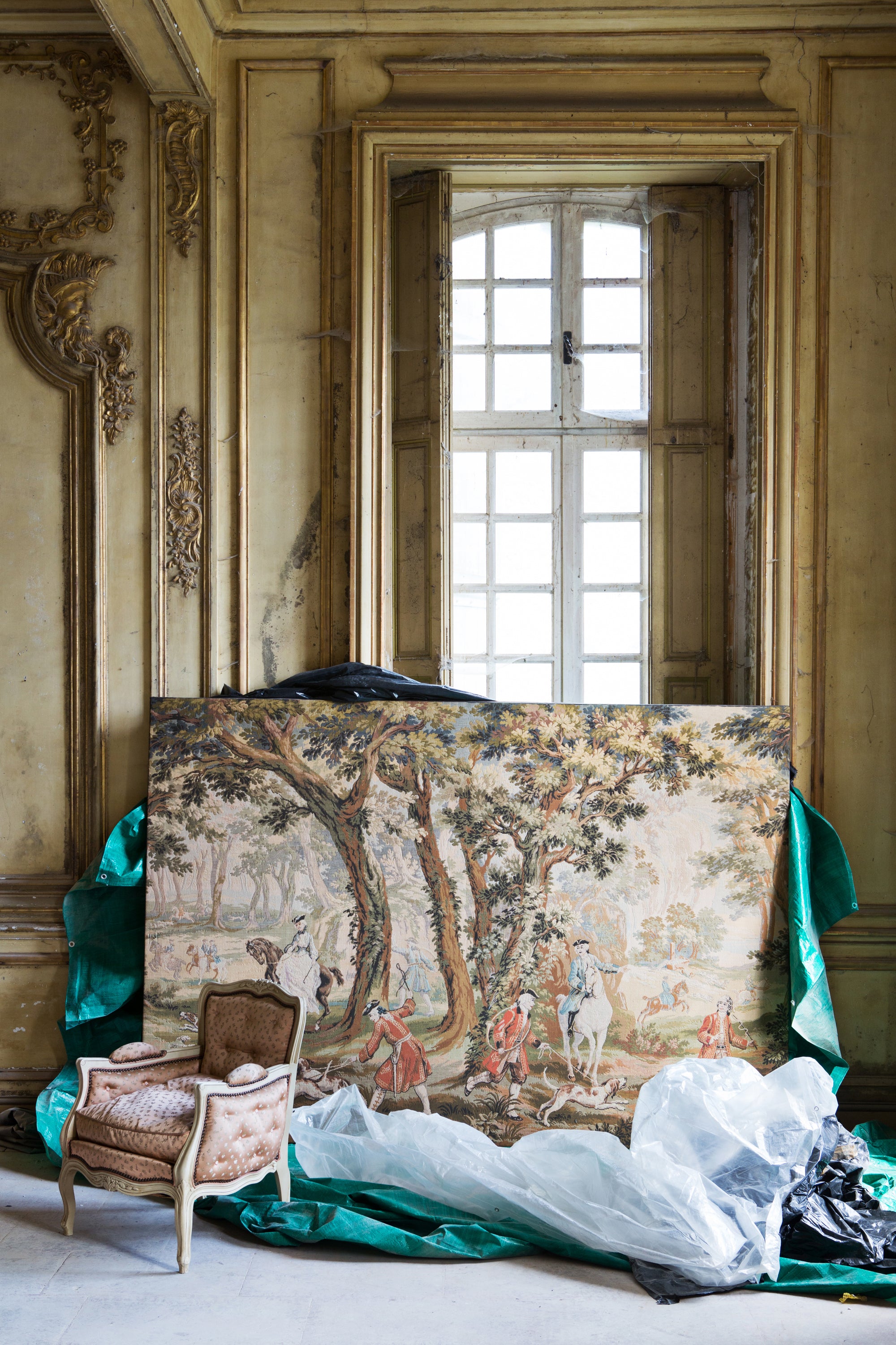 Decorative tapestry displayed in an ornate room with a window in the background, natural textures — luxury lifestyle photography by Carla Coulson